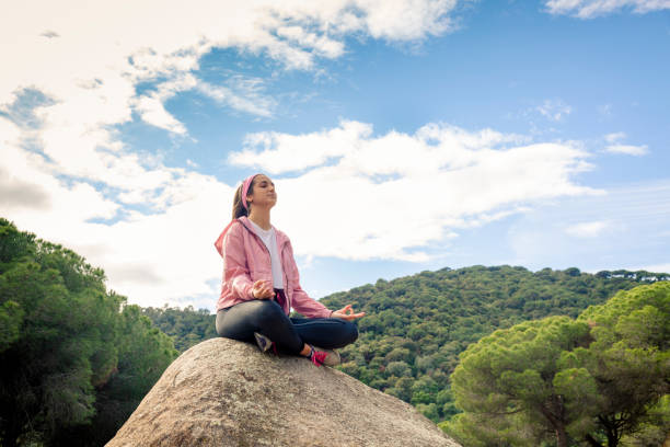 istock Woman practices yoga 1354925383