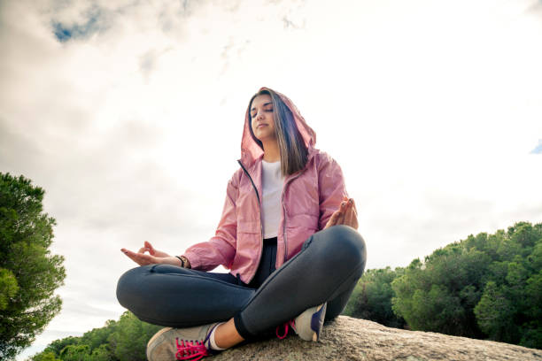 istock Woman practices yoga 1354925386