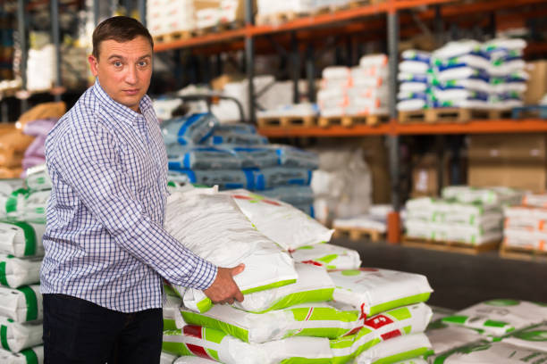 istock Ordinary man buying compost soil for gardening 1354927965