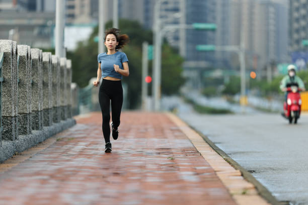istock Woman running in the city 1354930516