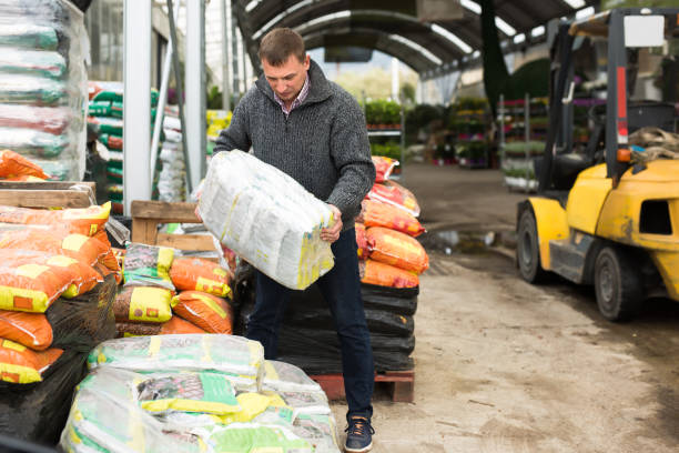 istock Focused male working in warehouse at garden store 1354930662