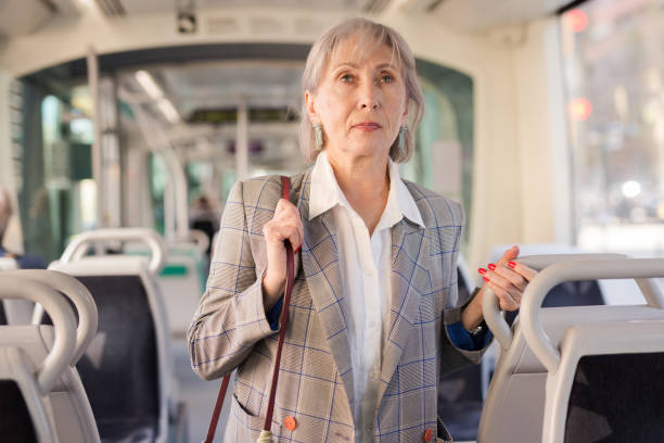 istock Woman standing in tram 1354931849