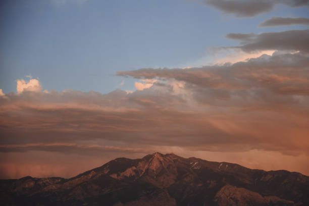 View of Zion National Park from along Grafton Road in Rockville Utah and huge thunderstorm building over peaks
