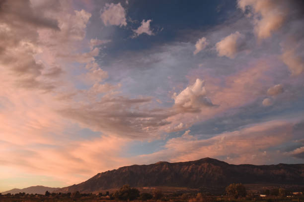 istock Sunset Over Mountains in Ogden Utah 1354935871