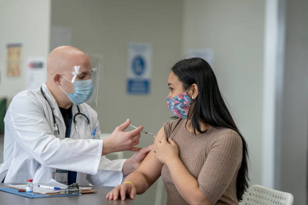 istock Woman Receiving Her Vaccination 1354938107