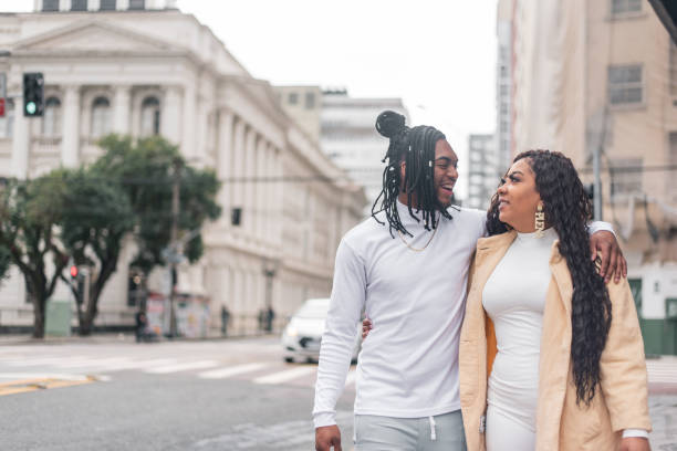 istock Black couple walking down the street 1354938661