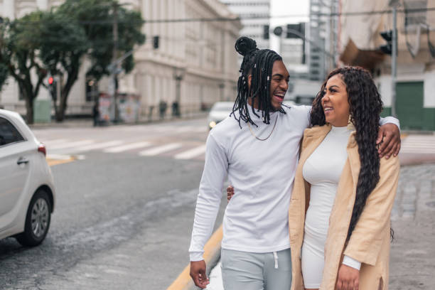 istock Black couple walking down the street 1354938672