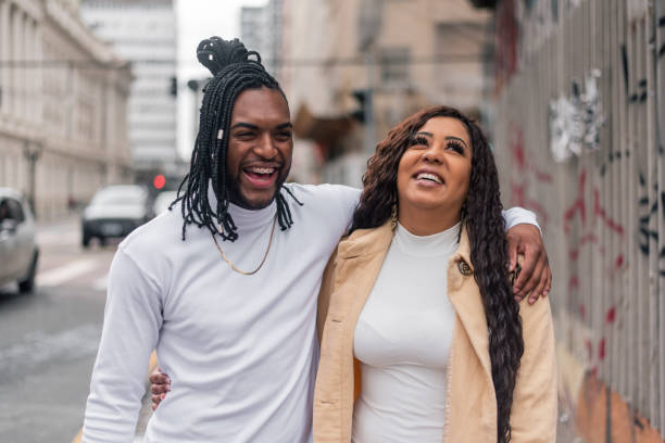istock Black couple walking down the street 1354938689