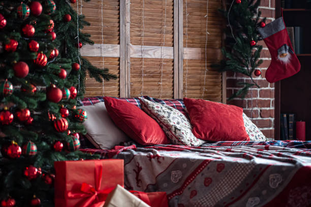 istock Bedroom interior with Christmas tree and decor details. 1354943237