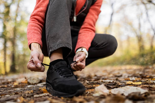 istock Senior Sportswoman Tying Shoelace 1354944761