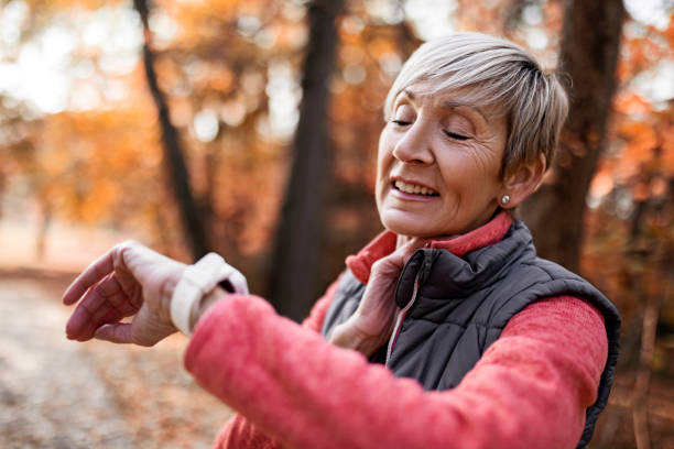istock Mature Woman Checking Her Pulse After Exercise 1354944800