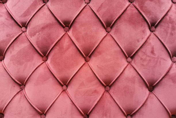 istock Textured background sofa in coral colors. 1354946415