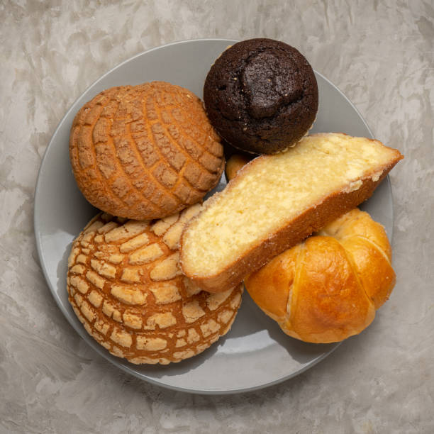 istock Basket with Mexican sweet breads on a gray background. 1354946551