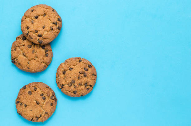 istock Cookies with chocolate on a blue background. 1354947614