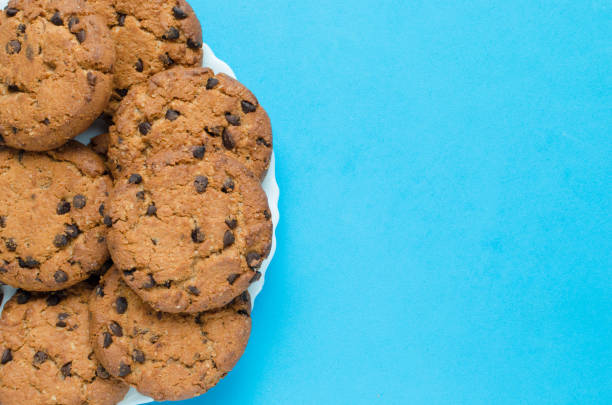 istock Cookies with chocolate on a blue background. 1354947616