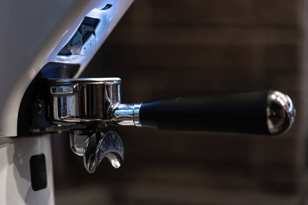 istock Close-up part of a coffee machine, a holder for coffee. 1354947989