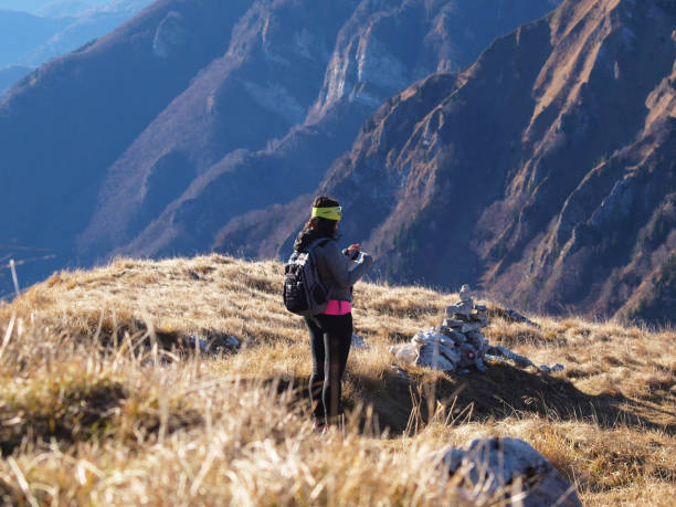 istock Woman hiking in the mountains 1354948219