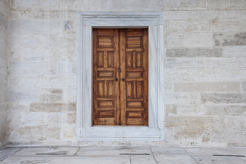 Old wood door with stone background