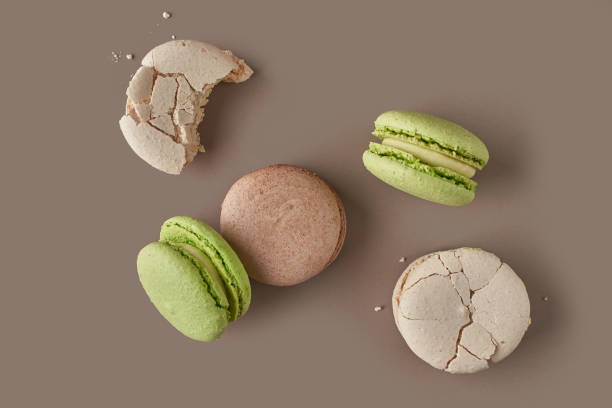 istock french macaron cookies on beige background 1354950754
