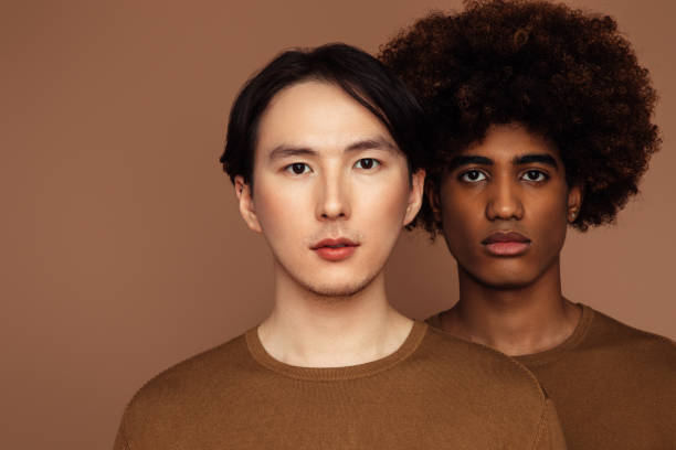 istock Emotional asian and african men 1354951094