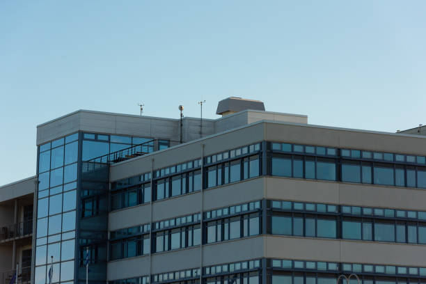 istock Top floors of a concrete and glass office complex.. 1354952244