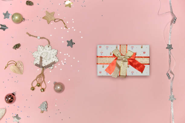 istock New Year, Christmas gift in white packaging paper with a red bow. 1354953666