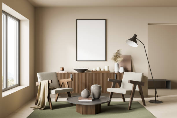 istock Empty canvas on beige wall. Modern living room seating idea 1354954073