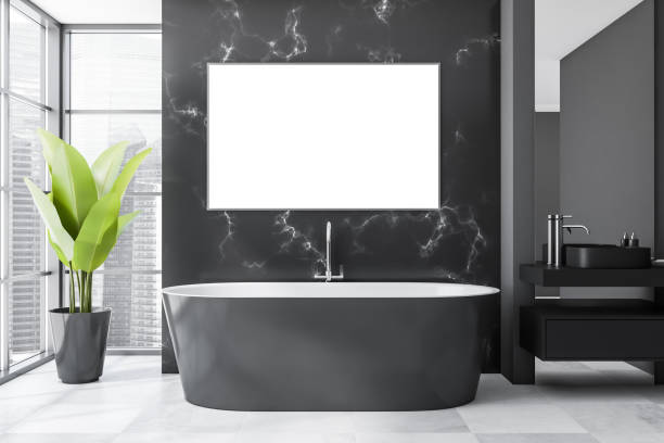 istock Dark bathroom interior with white empty poster, grey bathtub 1354954485