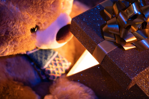 Cute Teddy Bear with Elegance Golden Gift Box for Celebration. Abstract of Elegance Jubilee Occasion Background and Banner Festival.