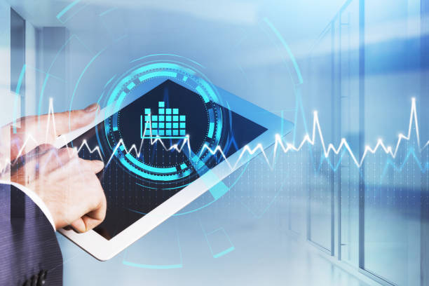 istock Businessman wearing formal suit is holding tablet and finger touching 1354955930