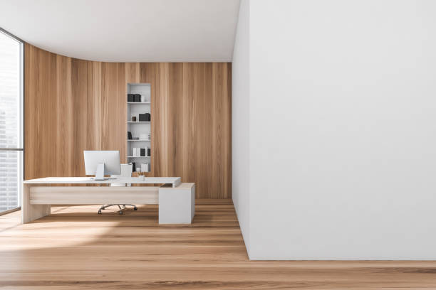 istock Wooden consulting room interior with table and computer near window. Mockup 1354957308