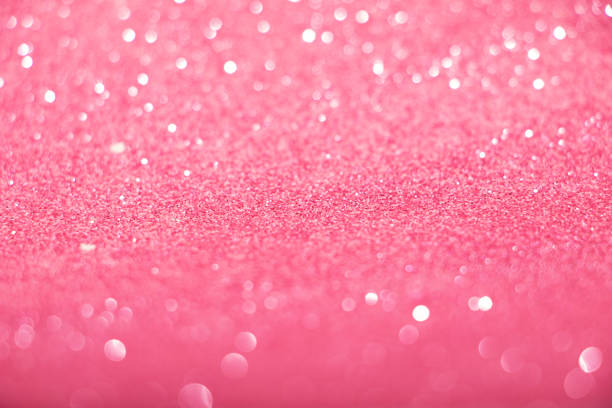 istock Defocused pink glittering background with shinig bokeh. 1354957776