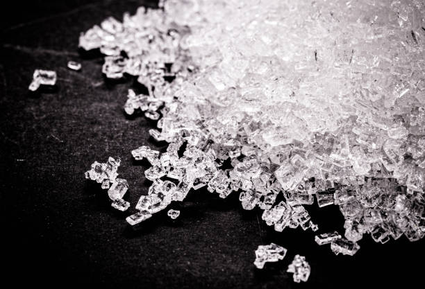 Sodium Thiosulfate on isolated black background. Solid and crystalline chemical product used in the pharmaceutical industry and in the analysis of drinking water Sodium Thiosulfate on isolated black background. Solid and crystalline chemical product used in the pharmaceutical industry and in the analysis of drinking water crystalline inclusion complex stock pictures, royalty-free photos & images