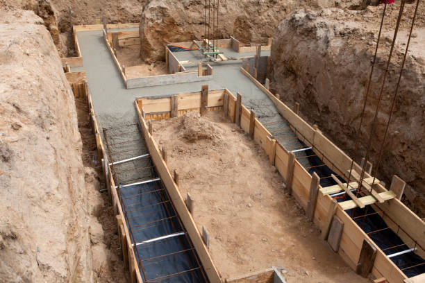 istock Preparation of formwork with reinforcement for a newly built house 1354960063