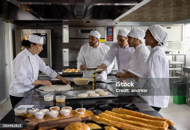 Head Chef Teaching A Baking Class At A Cooking Academy Stock Photo - Download Image Now
