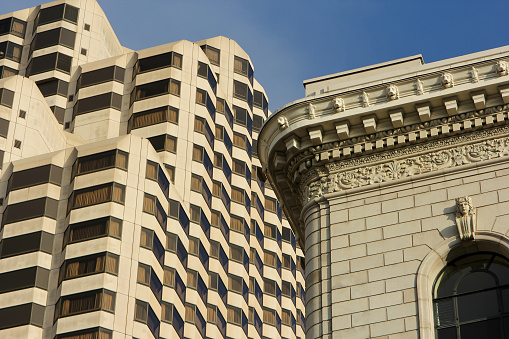 San Francisco, United States – November 20, 2022: A low angle of the Ritz-Carlton hotel in San Francisco, California against a blue sky