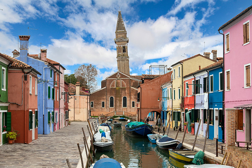 Colorful Houses in Burano beneath a scenic sky, Island of Venice, Italy