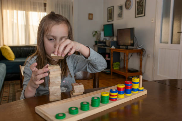 istock Girl playing with mathematical toy 1354966357