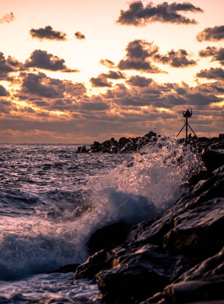 istock Waves crashing onto the Breakwater at sunrise 1354977320