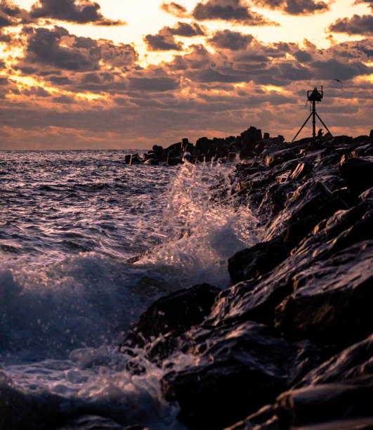 istock Waves crashing onto the Breakwater at sunrise 1354977336