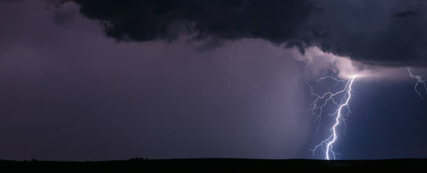 istock Lightning storm weather background 1354980811