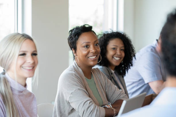 istock Diverse women attend professional training class or meeting 1354988372