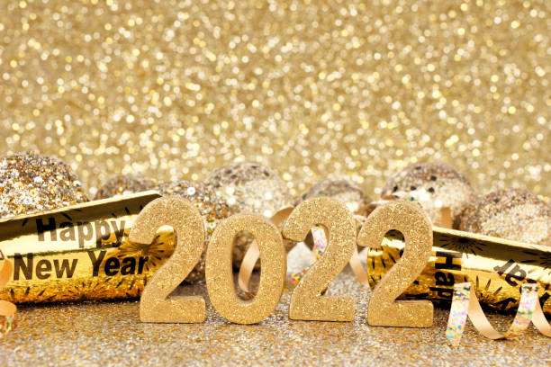 istock New Years Eve 2022 gold decorations with twinkling background 1354989698