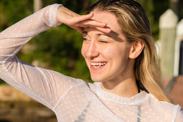 istock woman enjoying time in the sun 1354990931