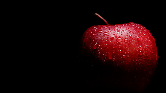 Apple Delicious Red Fresh Organic With Water Drops Against Black Background