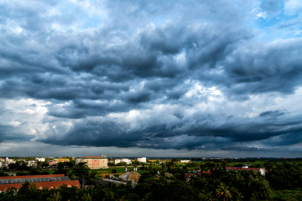 istock Dramatic dark storm rain clouds black sky background. Dark thunderstorm clouds rainy atmosphere. Meteorology danger windstorm disasters climate. Dark cloudscape storm disaster gloomy gray cloud sky 1355005952