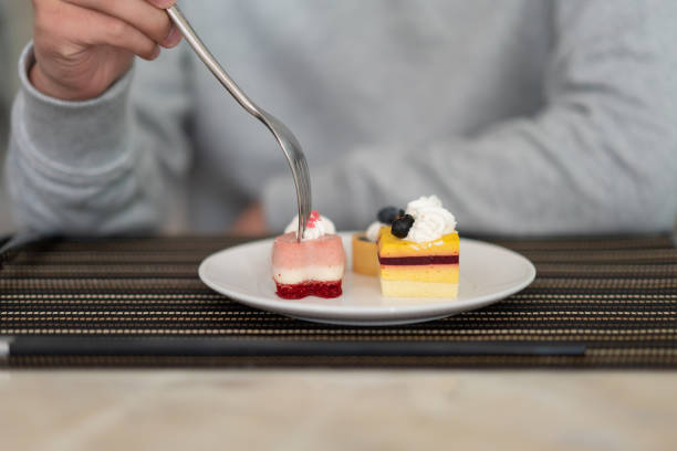 Beautiful and colourful cakes are seen in a modern cafe.