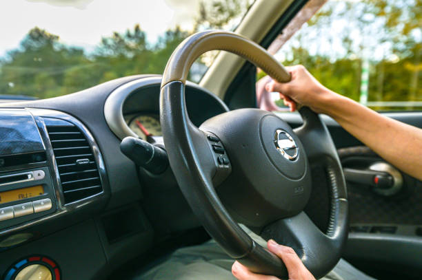 istock woman drive in car 1355015839