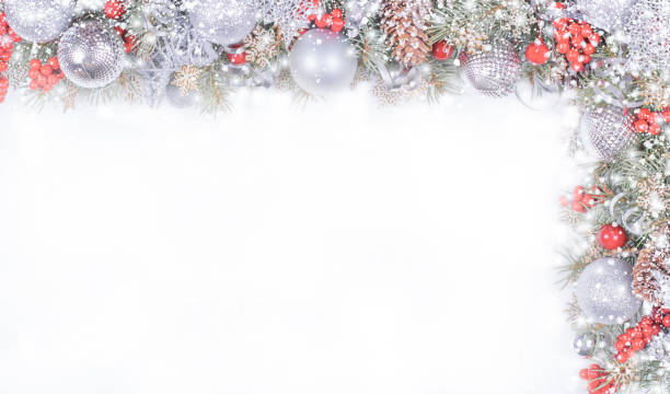 istock Christmas Card with Fir Branches, Silver Balls and Snowfall on White Background 1355017141