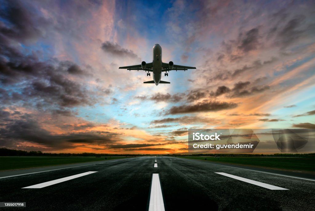 Passenger airplane taking of at sunrise Airplane Stock Photo